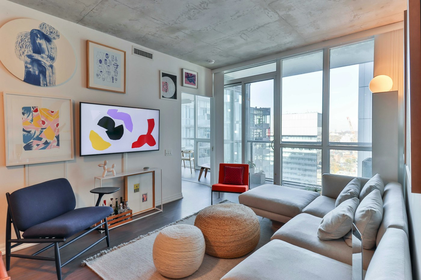 Toronto living room with large windows, colourful art and space to gather